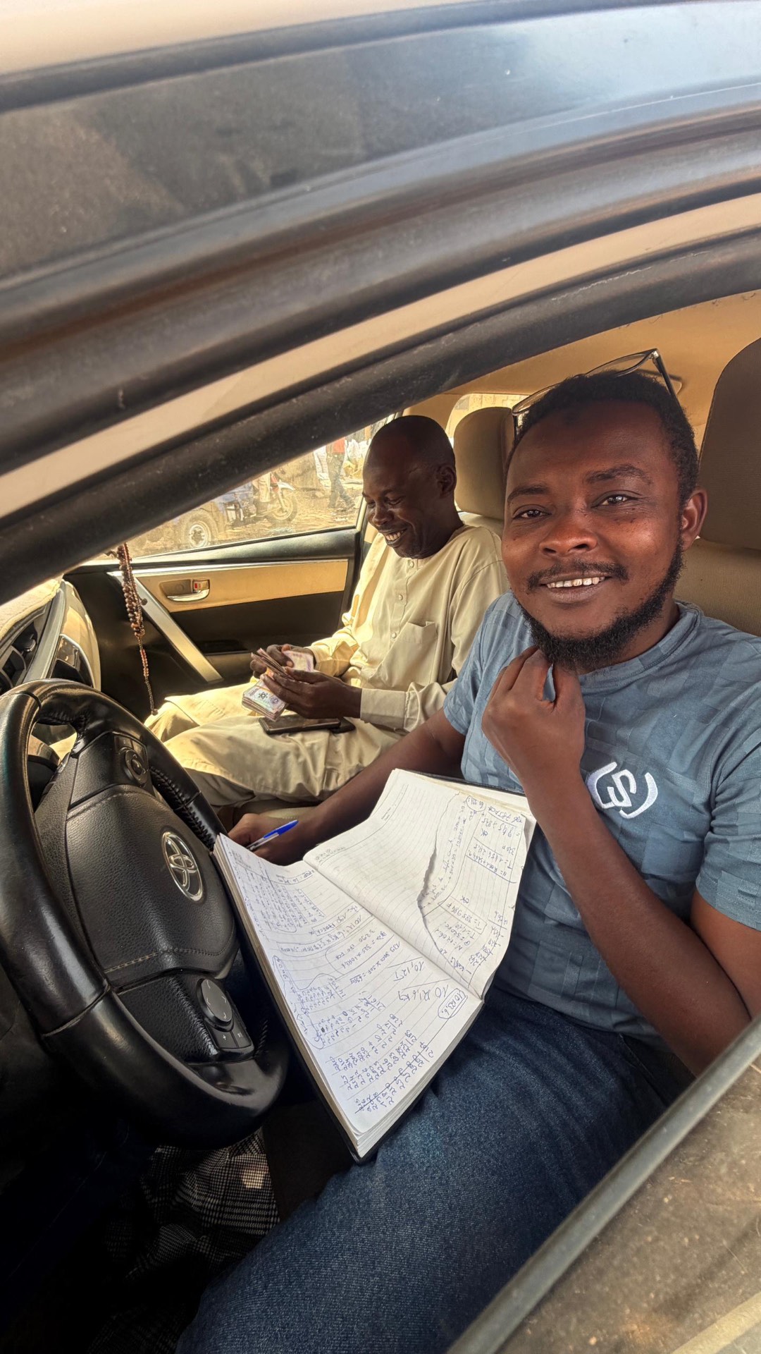 Purchase records being written up at a West African buying point